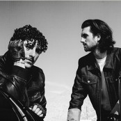 two men posing in black and white